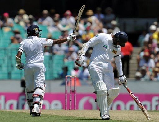 Mahela Jayawardene raises his bat after reaching 50 on day one of the third Test against Australia on January 3, 2013